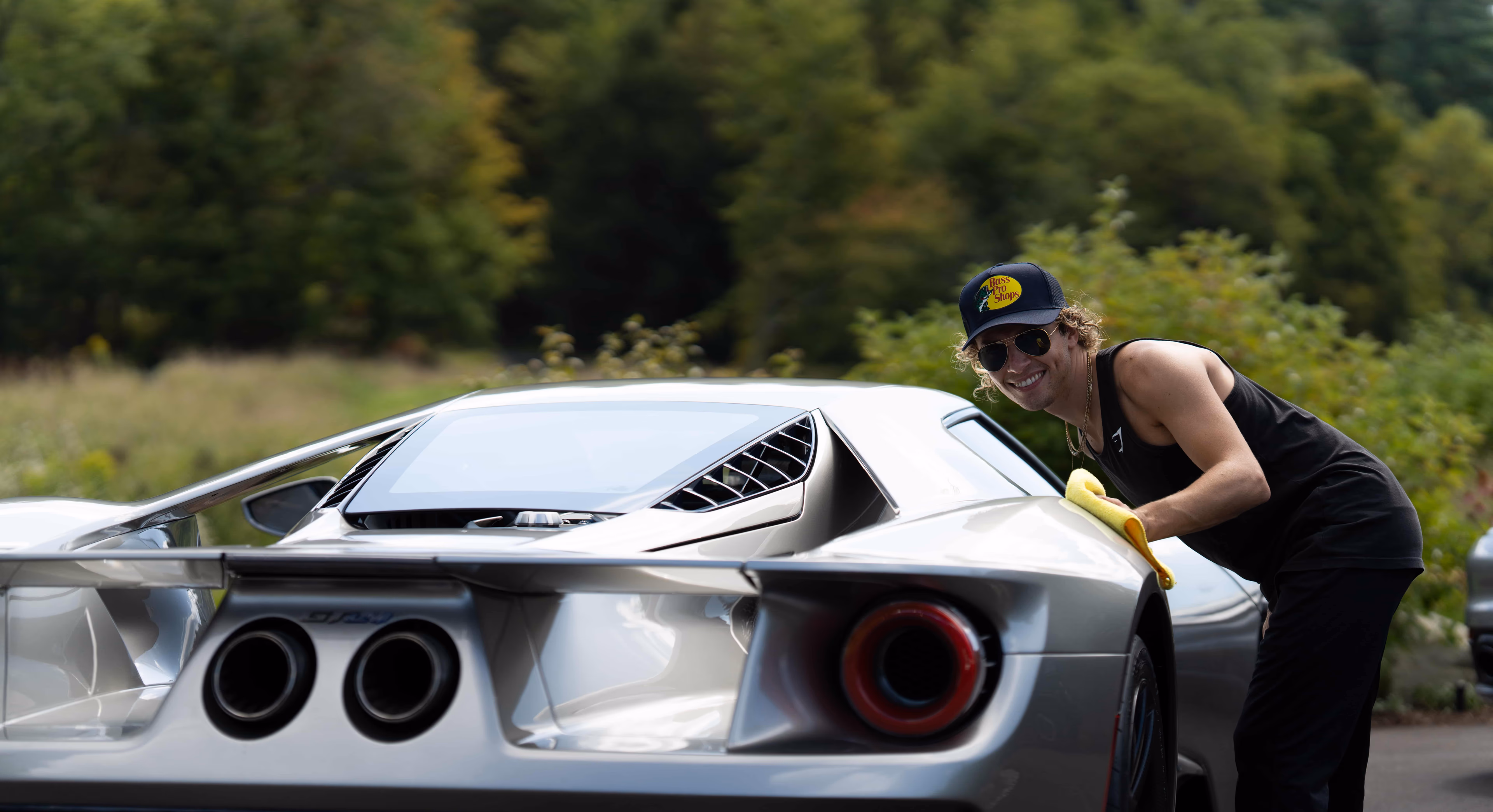 CEO Jake Ramos detailing a nice car